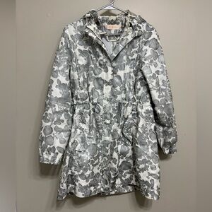 Tory Burch Shirley floral print hooded jacket is a grey and white. Womens size 6